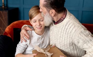 Grandson Giving Grandad A Gift