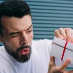 Man Not Excited About Receiving Gift