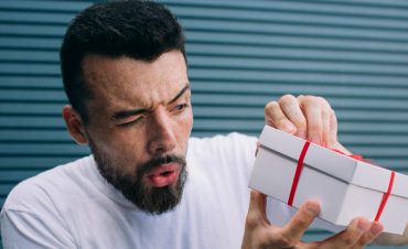 Man Not Excited About Receiving Gift